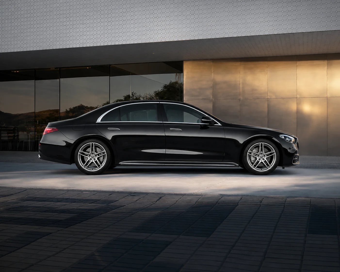 A black Mercedes-Benz S-Class luxury sedan facing right.