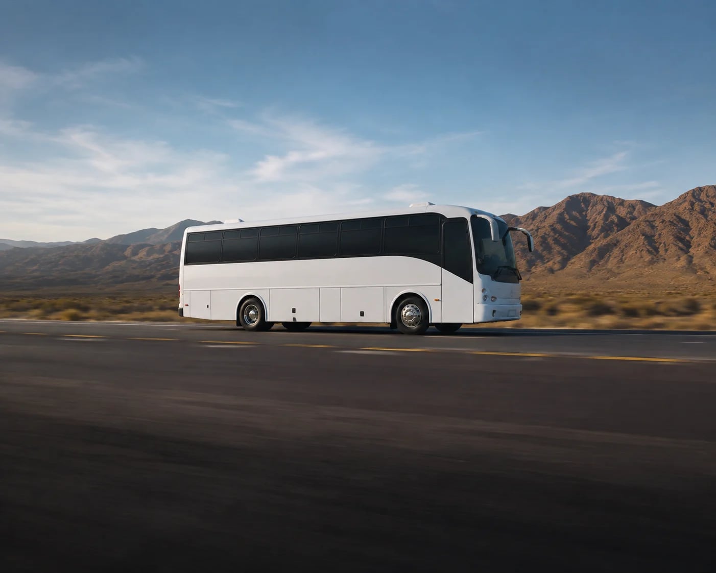 A white Danaro party bus facing right.